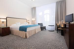 Postel nebo postele na pokoji v ubytování OREA Spa Hotel Bohemia Mariánské Lázně