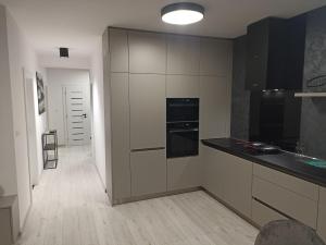 A kitchen or kitchenette at MBV28 Apartments
