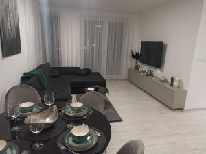 A television and/or entertainment centre at MBV28 Apartments