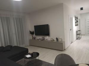 A television and/or entertainment centre at MBV28 Apartments