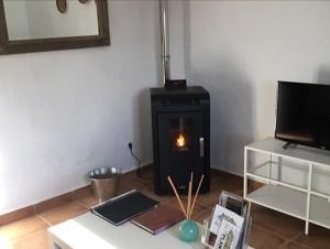 Telewizja i/lub zestaw kina domowego w obiekcie Cave Holidays Andalucia