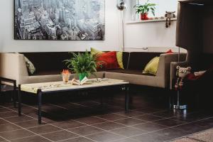 a living room with a couch and a coffee table at Academic Hostel in Tallinn