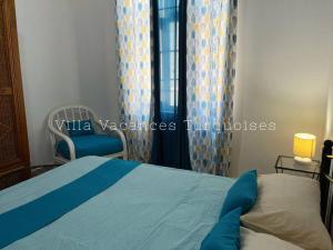 Säng eller sängar i ett rum på Maison Familiale - Vacances Turquoises