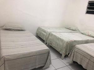 CASA DE TEMPORADA房間的床