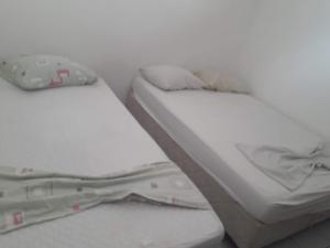 Una cama o camas en una habitación de CASA DE TEMPORADA