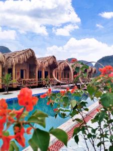 a view of a resort with a swimming pool at Hang Múa Lotus Homestay in Ninh Binh