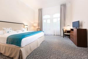 Postel nebo postele na pokoji v ubytování OREA Spa Hotel Bohemia Mariánské Lázně
