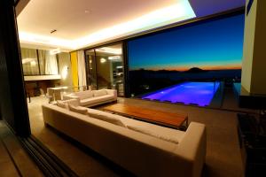 a living room with a large window with a view at Vistaport B - Luxury Villa in Bodrum City