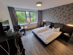 Postel nebo postele na pokoji v ubytování Nordic Avantage Hotel