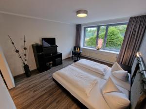 Postel nebo postele na pokoji v ubytování Nordic Avantage Hotel