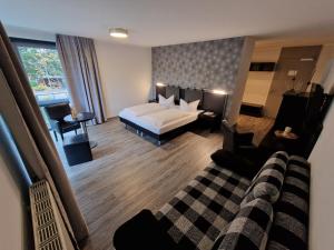 Postel nebo postele na pokoji v ubytování Nordic Avantage Hotel