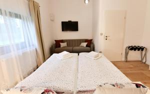 Posteľ alebo postele v izbe v ubytovaní Villa Diva Grabovčeva