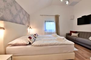 Posteľ alebo postele v izbe v ubytovaní Villa Diva Grabovčeva