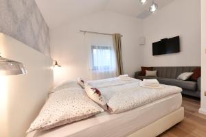 Posteľ alebo postele v izbe v ubytovaní Villa Diva Grabovčeva