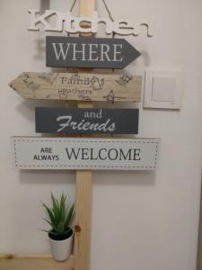 a sign that says where andfriends are always welcome at Apartman 7th Heaven in Zagreb