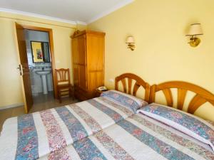 Postel nebo postele na pokoji v ubytování Hostal L'Anfora