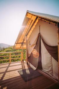 a tent on a deck with a view at Гора Глэмпинг in Besqaynar