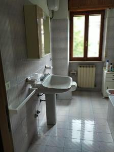 a bathroom with a sink and a toilet at Palazzina in Urbania