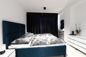 A bed or beds in a room at MBV28 Apartments Még 32 kép