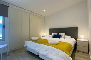 Postel nebo postele na pokoji v ubytování Casa do Mar South