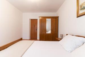Postel nebo postele na pokoji v ubytování Beachfront apartments Calm Sea