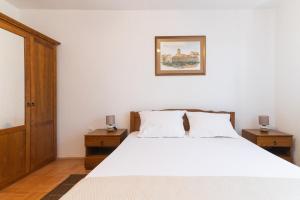 Postel nebo postele na pokoji v ubytování Beachfront apartments Calm Sea