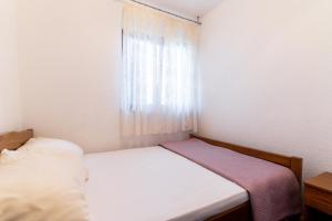 Postel nebo postele na pokoji v ubytování Beachfront apartments Calm Sea