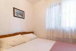 Postel nebo postele na pokoji v ubytování Beachfront apartments Calm Sea