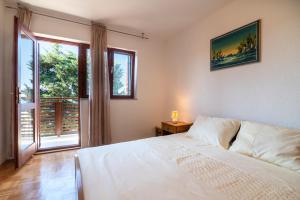 Postel nebo postele na pokoji v ubytování Beachfront apartments Calm Sea