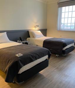 Cama o camas de una habitación en Almasur Punta Arenas