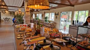 a buffet line with many different types of food at Arena Carneiros Hotel by AFT in Tamandaré