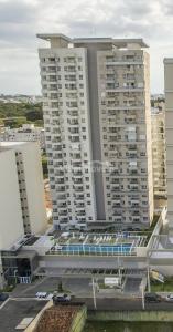 a view of two tall buildings in a city at Ap smart Campinas in Campinas