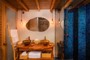 a bathroom with a sink and a mirror at Mama Lova Hôtel, Riad, Restaurant & Spa in Essaouira +37 photos
