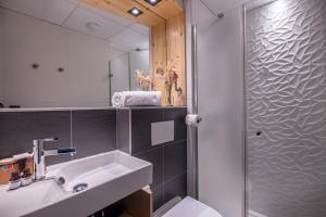 a bathroom with a sink and a shower at Urban Bivouac Hotel in Paris