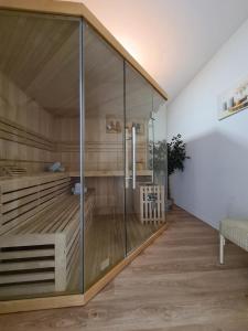 a room with a shower with glass walls at Villa Beau Site in Saint-Maurice
