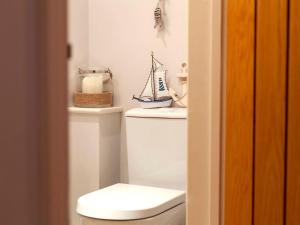 a bathroom with a white toilet in a room at Number Two in Southampton +37 photos