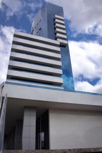 a tall building with a sky in the background at Kariris Blue Tower in Crato