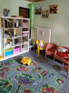 a childs room with a toy track on the floor at Pintelie - für 2-6 Personen in Sankt Englmar