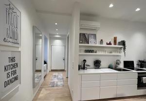 Kuchyň nebo kuchyňský kout v ubytování Lieblingsplatz Neusiedl Appartement - Erhol dich gut