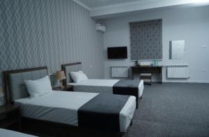 TASHRIF HOTEL客房内的一张或多张床位