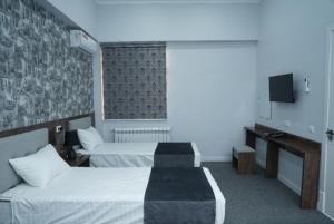 TASHRIF HOTEL客房内的一张或多张床位