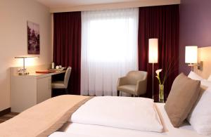 Cama o camas de una habitación en Leonardo Hotel Köln