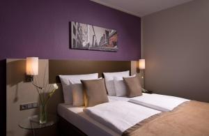 Cama o camas de una habitación en Leonardo Hotel Köln