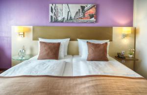 Cama o camas de una habitación en Leonardo Hotel Köln
