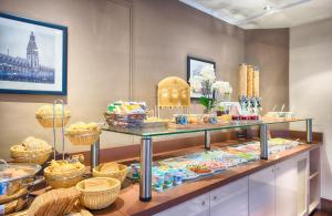 a display case in a store filled with food at Leonardo Inn Hotel Hamburg Airport in Hamburg