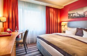 Postel nebo postele na pokoji v ubytování Leonardo Hotel Heidelberg