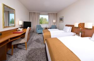 Postel nebo postele na pokoji v ubytování Leonardo Hotel Heidelberg + 37 fotografií