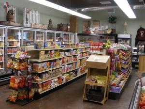 a store aisle of a grocery store filled with food at Eagle Rock Resort in Naches