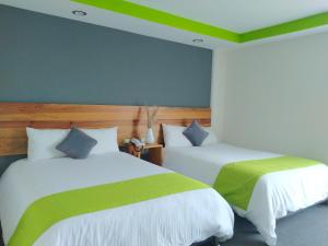 Postel nebo postele na pokoji v ubytování Hotel Brisas Express