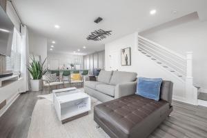 a living room with a couch and a table at New Construction Located in Ybor City! in Tampa